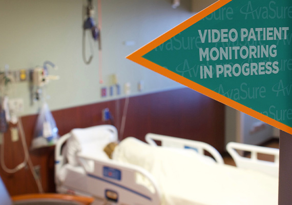 Video patient monitoring sign on door